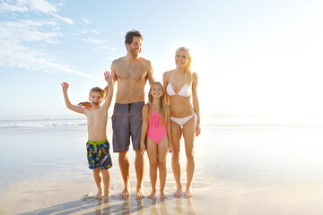 Blue sky, smile and family with children at beach in swimsuit for holiday trip, summer vacation or...