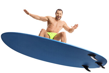 Man riding a surfboard and smiling