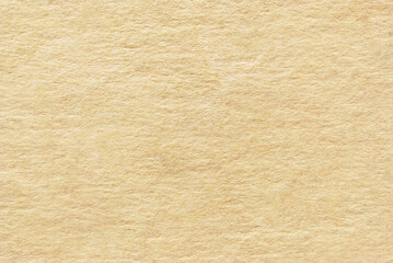 A sheet of creased beige recycled craft paper texture as background