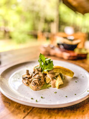 grilled mushrooms with vegetables and tahini sauce (vegan dish)