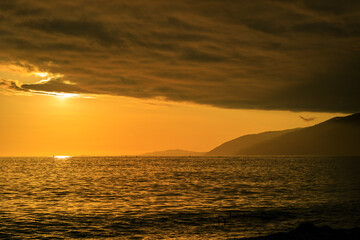 Fototapeta premium The sky is orange and the sun is setting