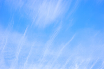 sky with feathery clouds on a blue background