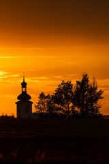 Beautiful sunset and catholic church in the background