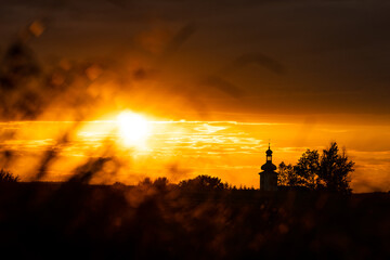 Beautiful sunset and catholic church in the background