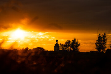 Beautiful sunset and catholic church in the background