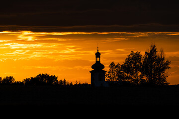 Beautiful sunset and catholic church in the background