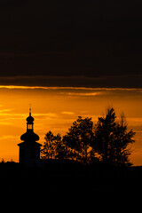 Beautiful sunset and catholic church in the background