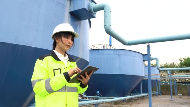 A female engineer working at a water treatment plant, inspecting and maintaining the water supply system, checking chlorine levels, ensuring water quality, and overseeing the dynamo motors and control