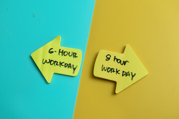 Concept of 6 Hour workday or 8 hour workday write on sticky notes isolated on Wooden Table.