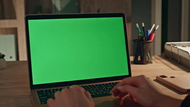 Businesswoman looking green screen laptop at home office closeup. Manager work 