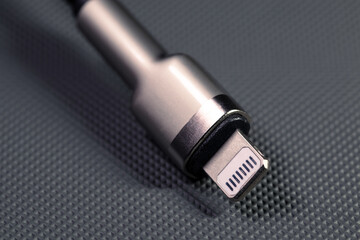 Lightning cable close-up on a gray background