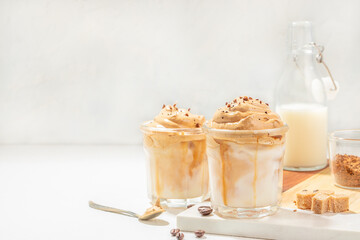 Dalgona whipped, instant, cream coffee on a light background. trendy and popular drink