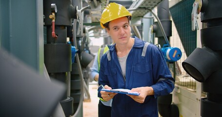 Civil engineer manager and foreman worker checking industry cooling air conditioner water cooling...