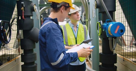 Civil engineer manager and foreman worker checking industry cooling air conditioner water cooling...