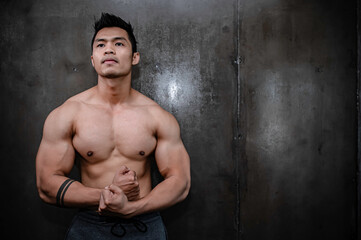 Portrait of asian man big muscle at the gym,Thailand people,Workout for good healthy,Body weight training,Fitness at the gym concept