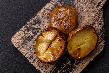 Delicious halved potatoes grilled with salt, spices and herbs