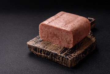 Delicious canned pink ham with salt, spices and herbs