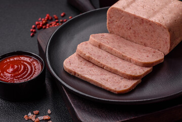 Delicious canned pink ham with salt, spices and herbs