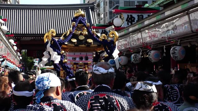 ASAKUSA, TOKYO, JAPAN - 18 MAY 2024 : Scenery of SANJA MATSURI (SANJA FESTIVAL) in Asakusa city. Japanese summer festival concept video. Slow motion shot.