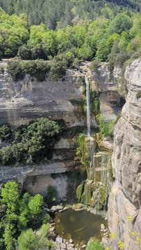 Spain. 2024. Rupit. Breathtaking Aerial View of a Majestic Waterfall and Lush Greenery. Stunning Views from High Above. Perfect for Nature Enthusiasts and Relaxation Videos. Tranquil Scenes of Nature'