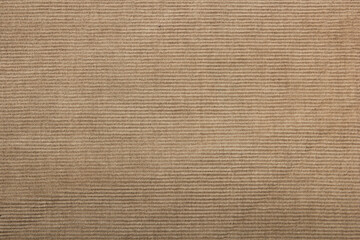 beige corduroy fabric background. slightly worn