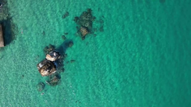 Aerial view of the bay of Golden Beach on Thassos with people relaxing on the shore