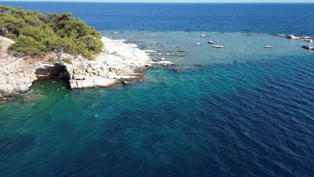 Aerial view of the Aliki Beach quarry and beautiful blue waters in Thassos, Greece