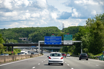 Driving on highway and road signs to Paris and other French cities, different types or roads in ...