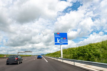 Driving on highway and road signs to Paris and other French cities, different types or roads in ...