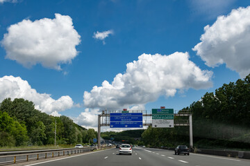 Driving on highway and road signs to Paris and other French cities, different types or roads in ...