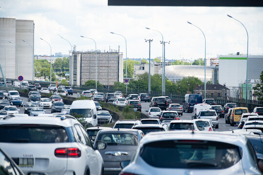 Driving in heavy traffic on ring road of capital of France, traffic jam problems in Paris