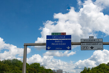 Driving on highway and road signs to Paris and other French cities, different types or roads in ...