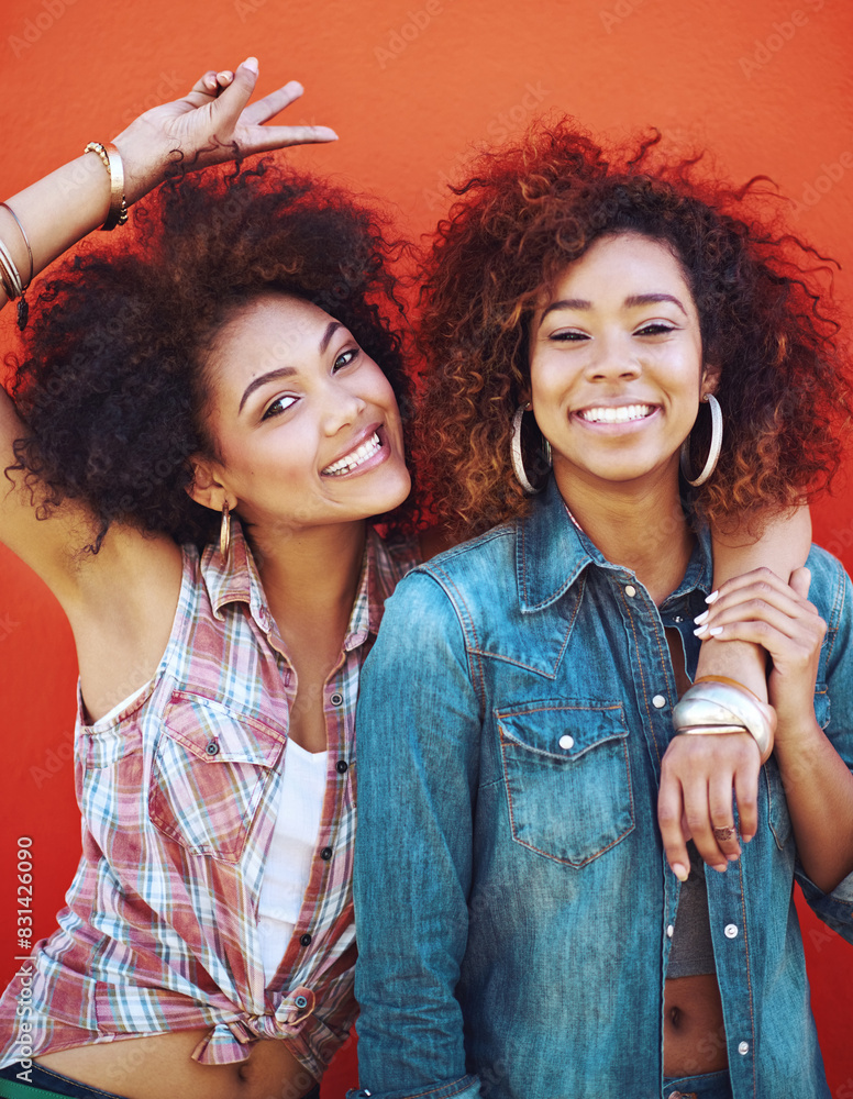 Poster Women, smile and portrait or fashion in studio with casual style, trendy outfit and collaboration on red background. Girls, friends and hug in city with streetwear, afro or peace sign in edgy clothes