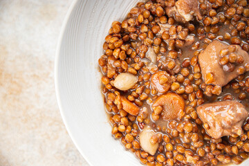 lentils with meat beef or pork fresh cooking appetizer meal food snack on the table copy space food background rustic