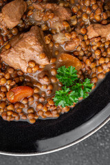 lentils with meat beef or pork fresh cooking appetizer meal food snack on the table copy space food background rustic