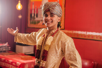 Young man inviting to come to the traditional ceremony of his culture. Concept: religion, devotees