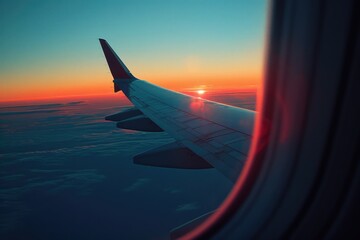 Airfare. Airplane Sunset View from Window with Wing in Blue Sky
