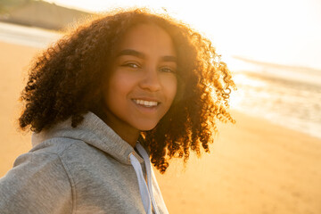 Mixed Race Biracial African American Girl Teenager Smiling at Sunset on a Beach