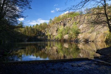 View into the old flooded quarry from the entrance in the spring. Olsovec. Central Moravia. Europe. 