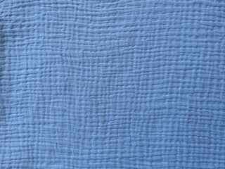 Muslin cloth texture background in blue tones. Cotton fabric structure
