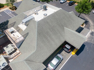 Drone Images of Commercial Roofs Featuring TPO and Asphalt Shingles: Midday, Sunny, No People