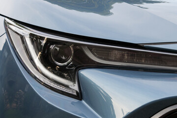 Car headlight of modern sports car close up