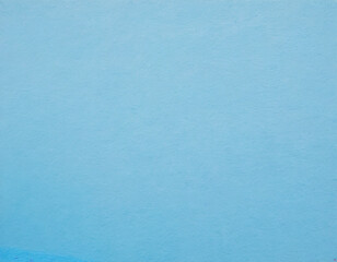 background of a very old blue wall you can see cracks.