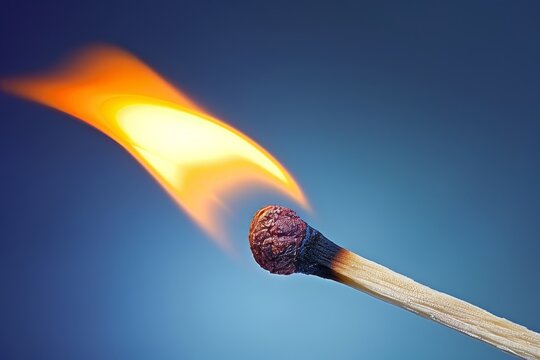 Detailed macro shot of a matchstick igniting in extreme close up, capturing the moment of ignition