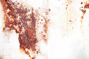 Rusty metal background with streaks of rust. Rust stains. The metal surface rusted spots. Rusty...