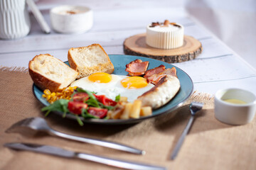 fried eggs with bacon and cheese