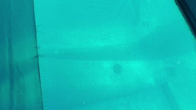 Snorkeler investigates the famous sunken C130 hercules airplane wreck at a dive site in the coral reefs of Aqaba, Jordan