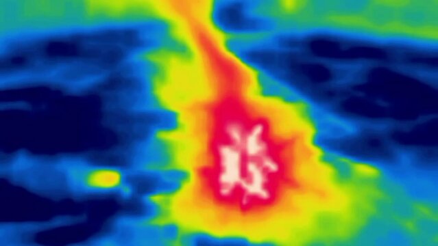 Campfire shadows. Sit over the fire, plumes of smoke. Thermal Impressionism. Image from thermal imager device