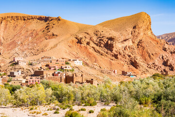 Fototapeta premium Traditional village with clay houses in mountain landscape of Dades valley, Morocco, North Africa