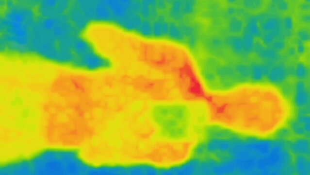 Flipping finger through the pages of a touchscreen smartphone by a person (vertical video, back view). Image from thermal imager device. Vertical video